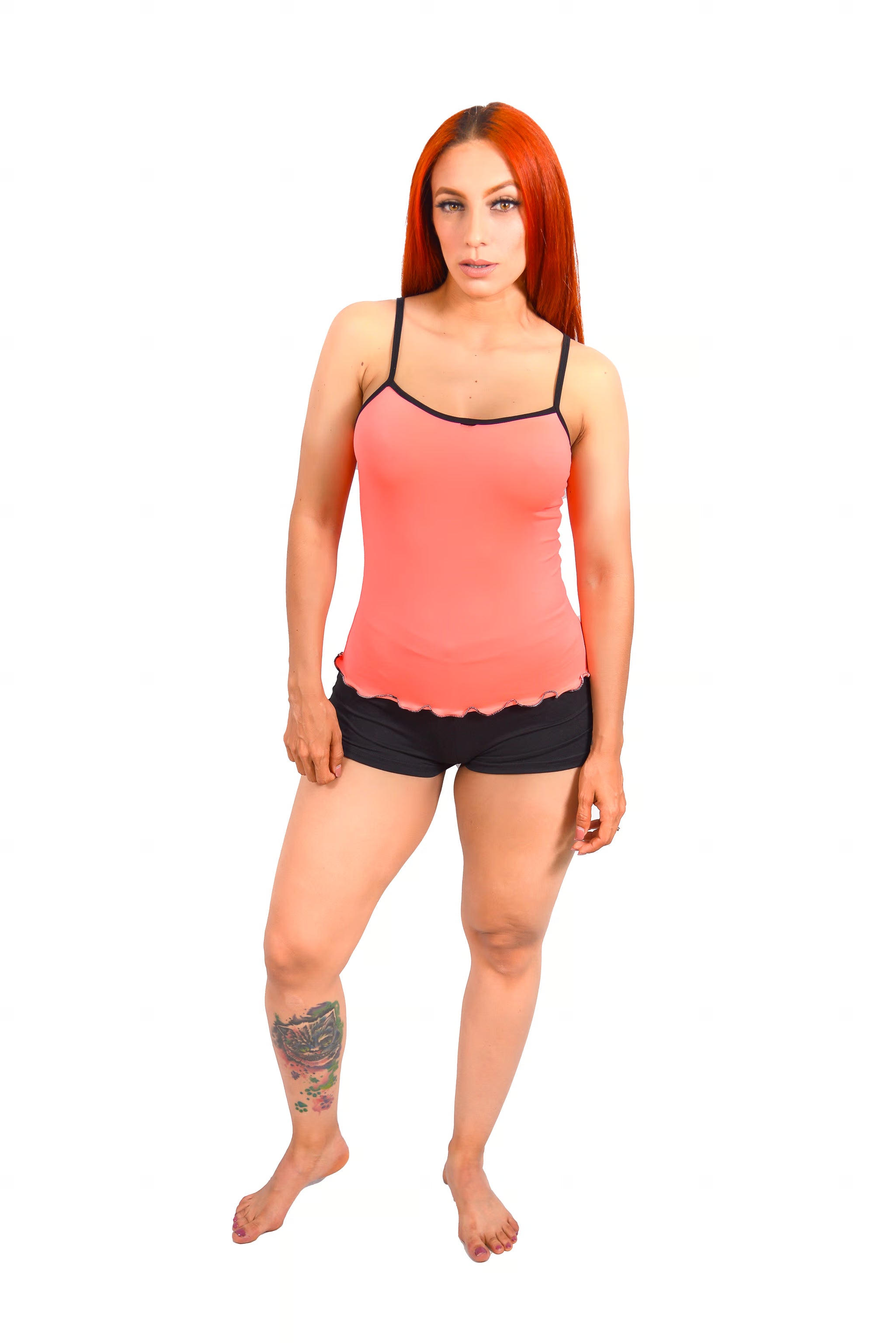 Woman wearing Popular coral cami top & black shorts pajama set on white background