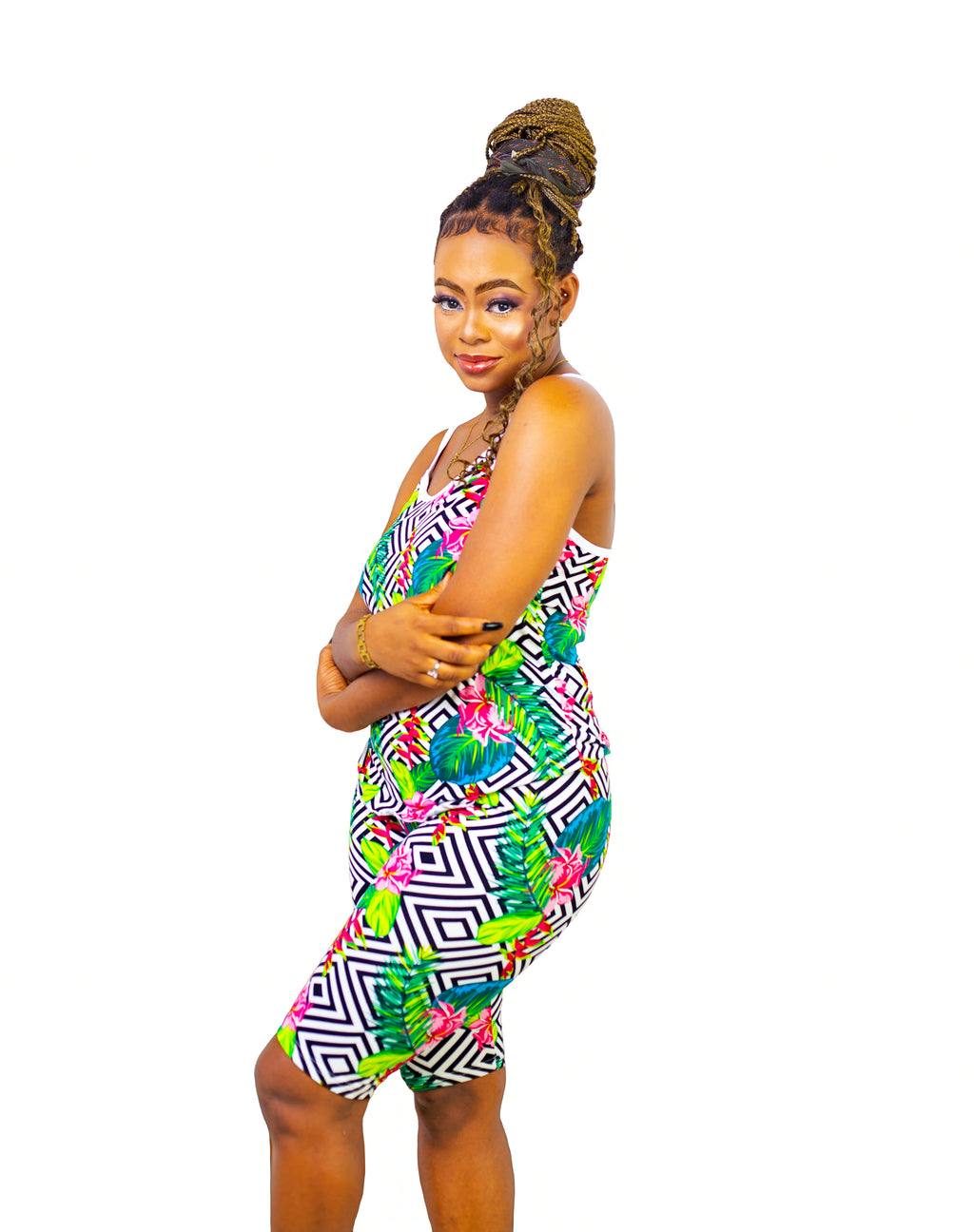 Woman wearing a colorful multicolor patterned pajama set on a white background