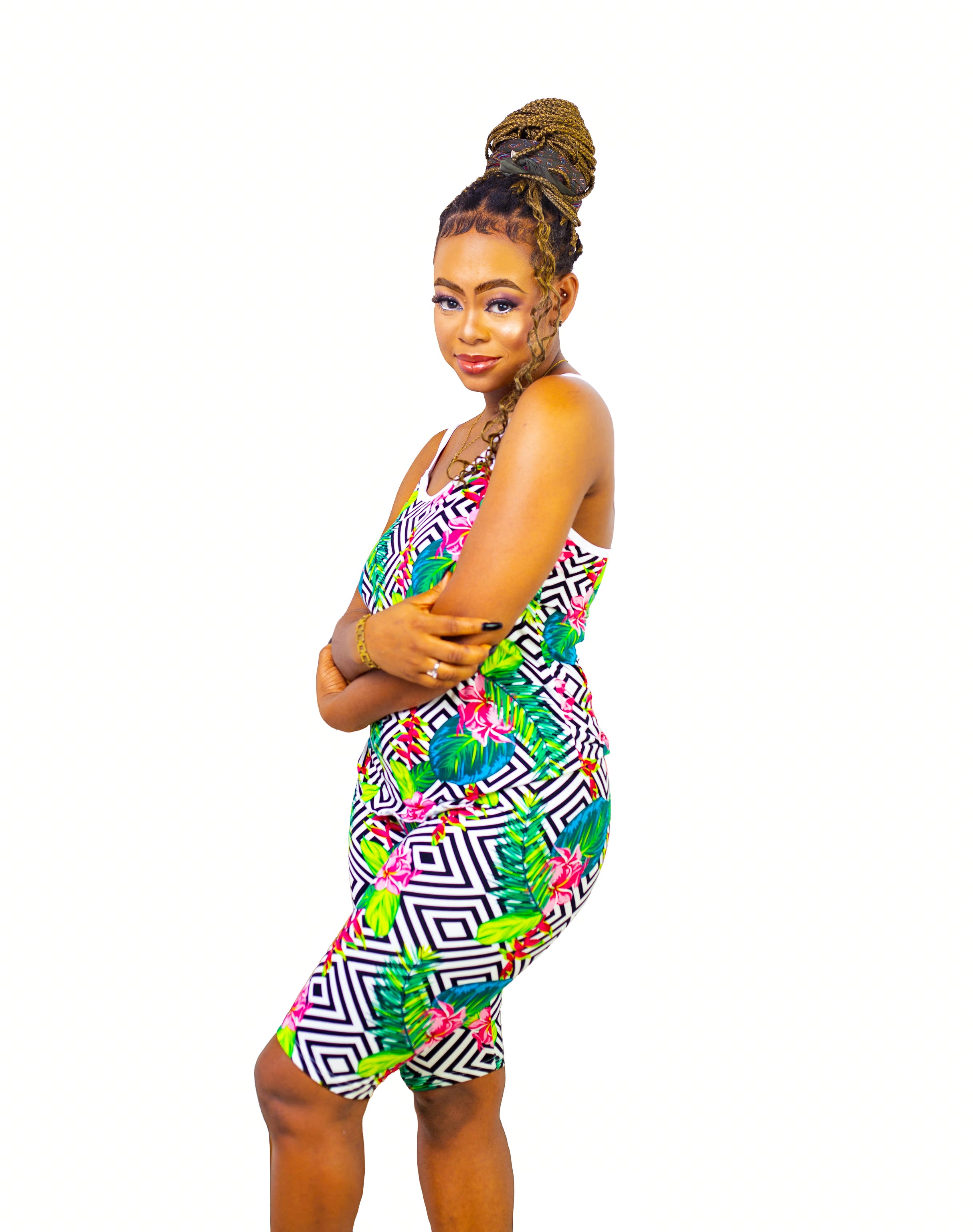 Woman wearing a colorful multicolor patterned pajama set on a white background