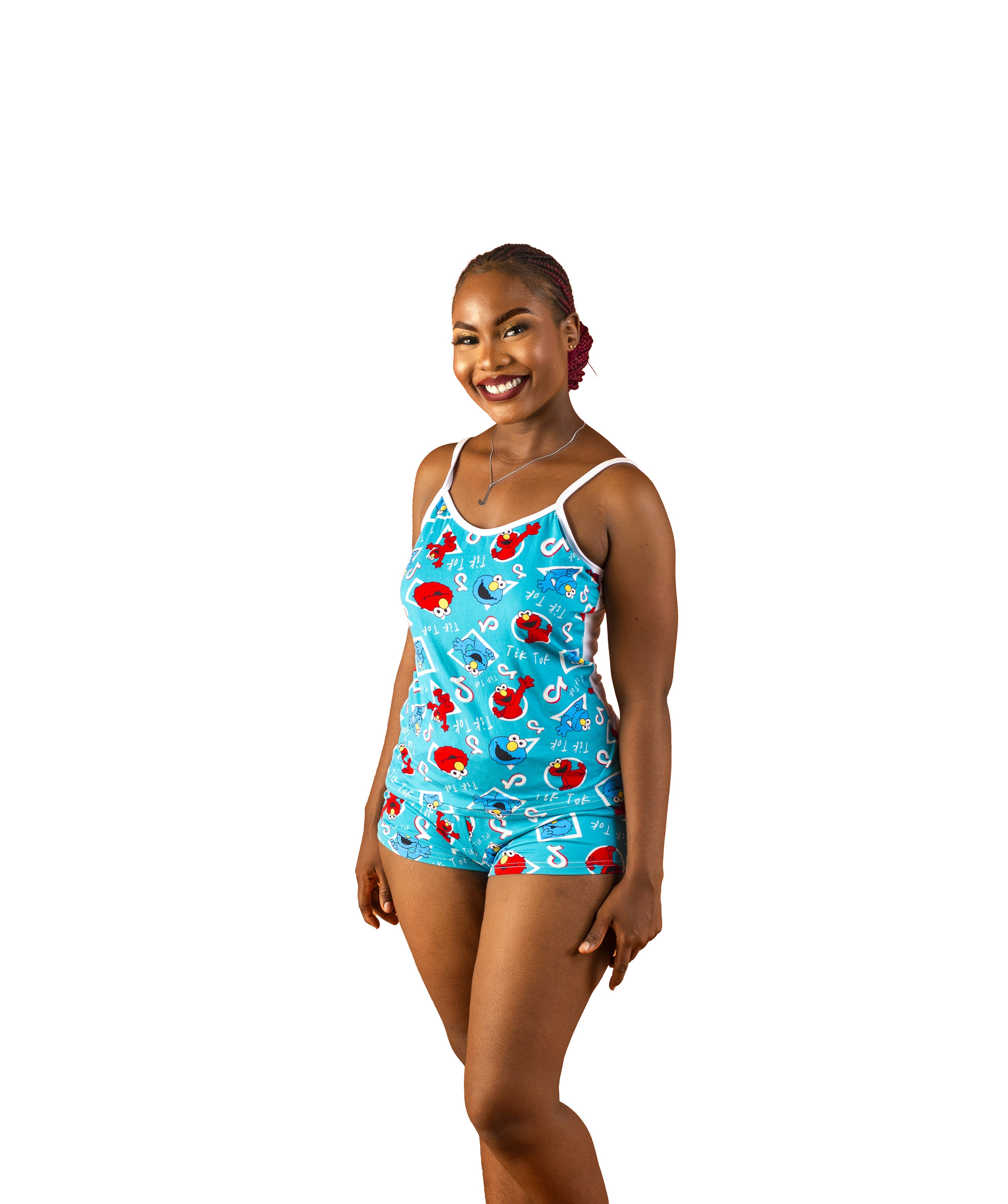 Woman wearing a blue, red, Tik Tok 2-piece pajama set and white patterns on a white background