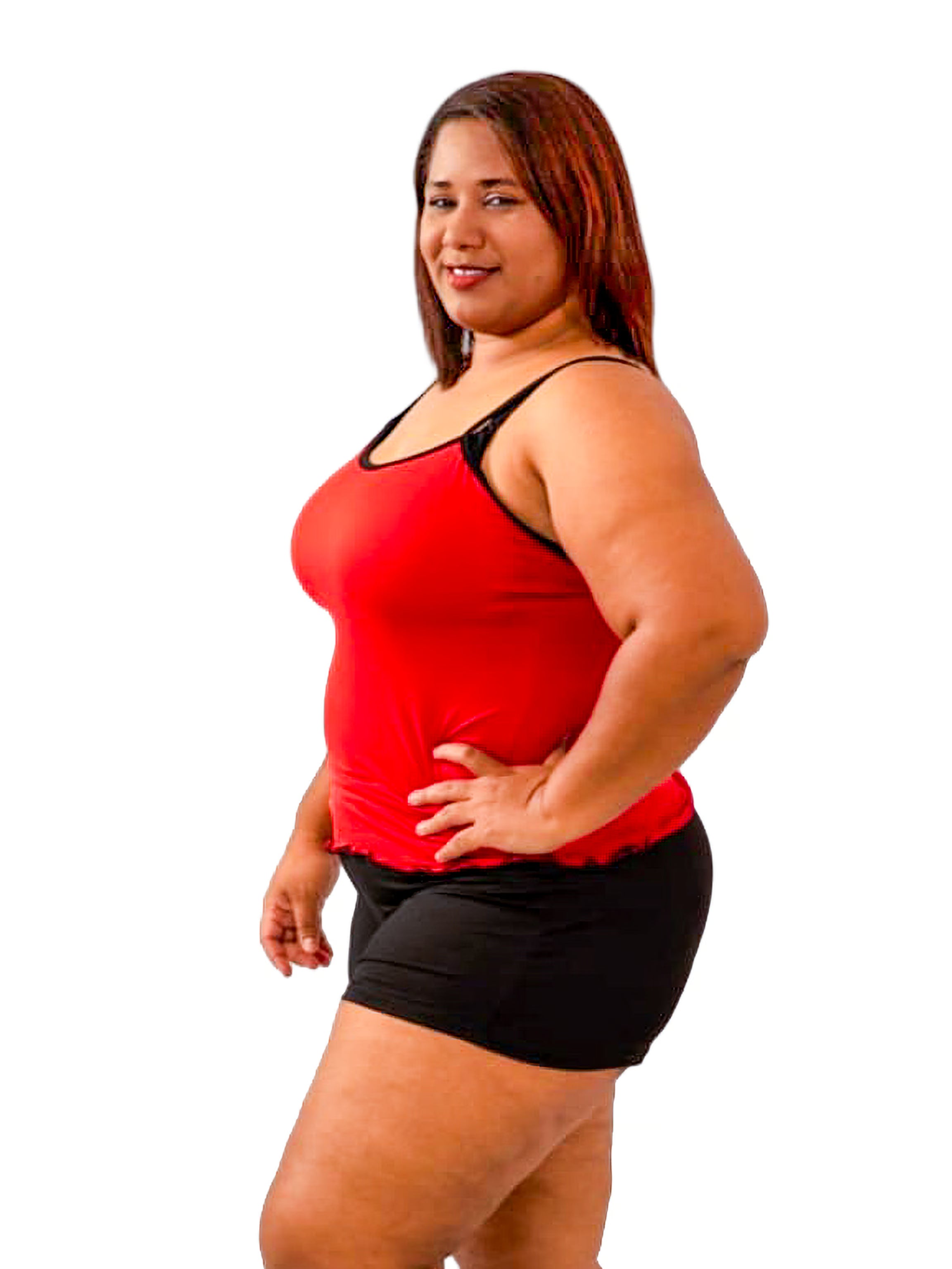 Woman wearing a red and black cami sleepwear set, with hand on hip on a white background
