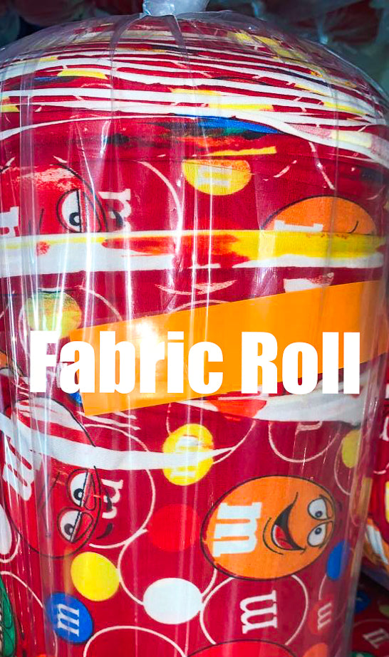 Red fabric roll with colorful patterns and text, labeled 'Fabric Roll'.