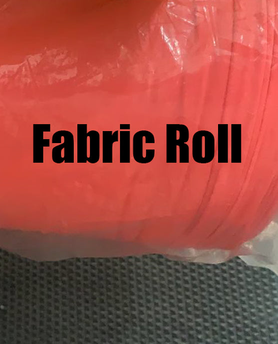 Fabric roll with clear plastic wrap on a textured surface