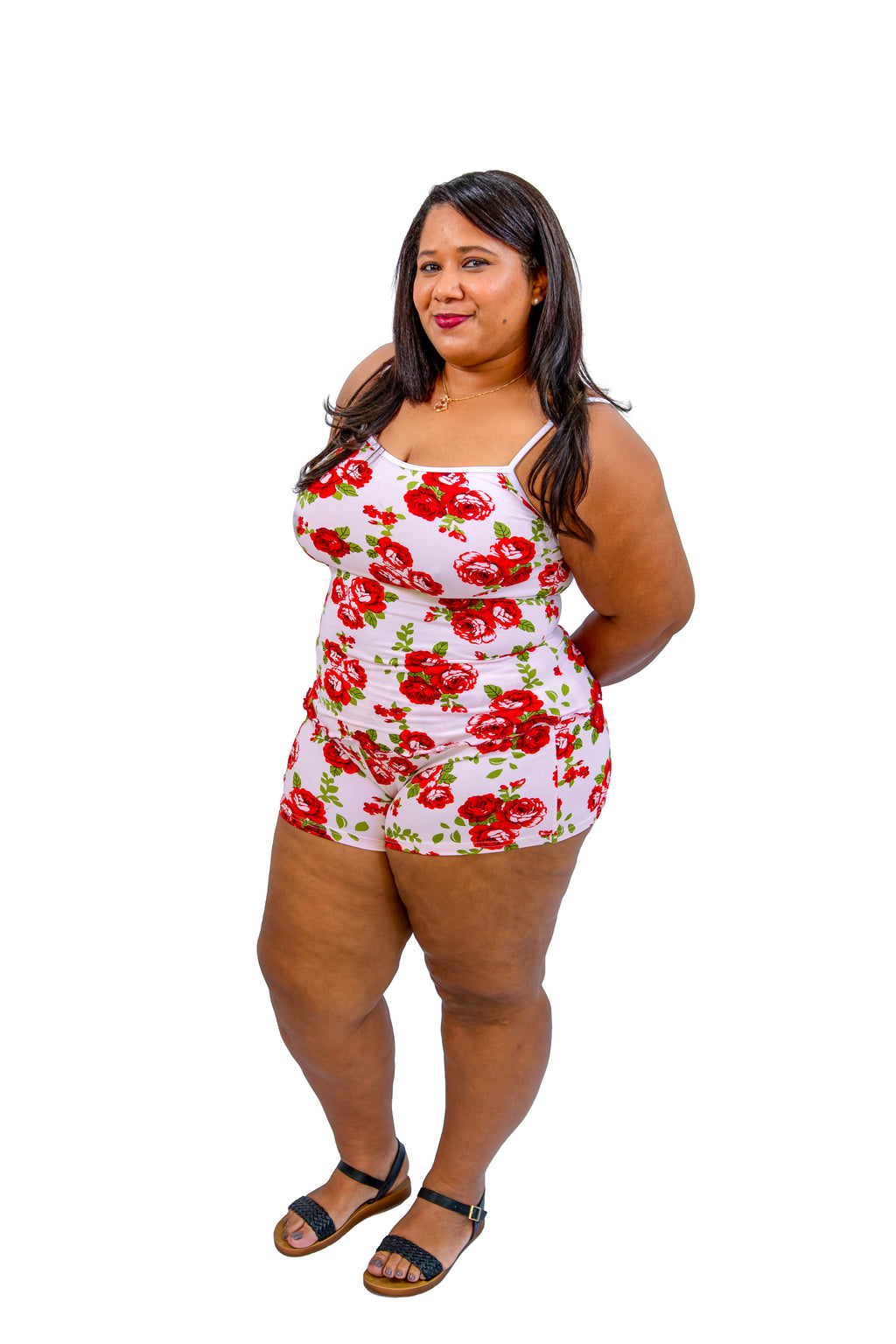 Woman wearing the Rose Garden 2-Piece Cami Set featuring red rose pattern on a white background